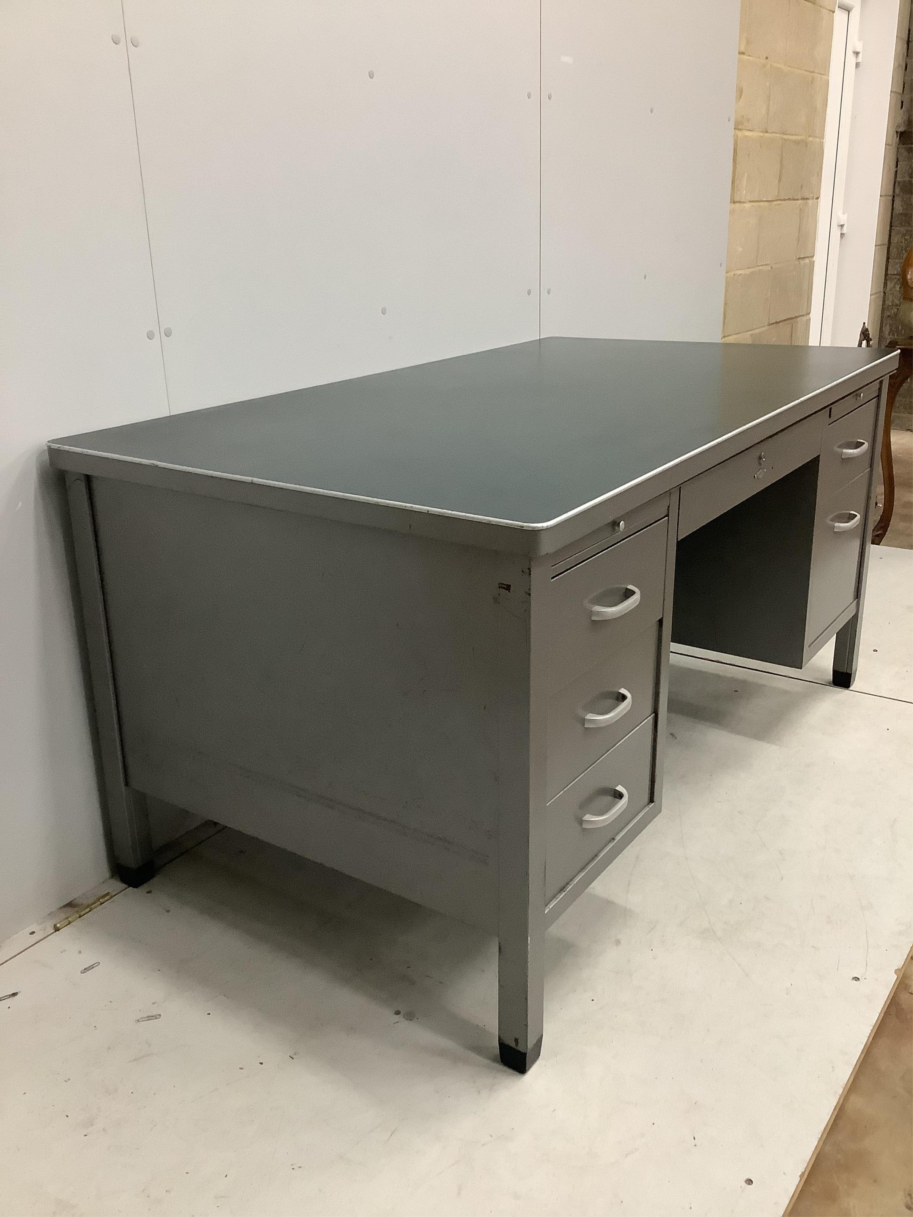 A mid century Art Metal steel kneehole desk, width 152cm, depth 86cm, height 78cm. Condition - fair